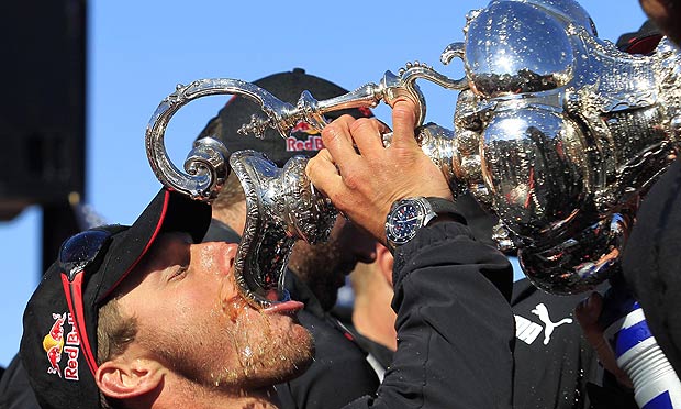 Ben Ainslie, Oracle Team USA's tactician, drinks from the America's Cup trophy after their 9-8 win