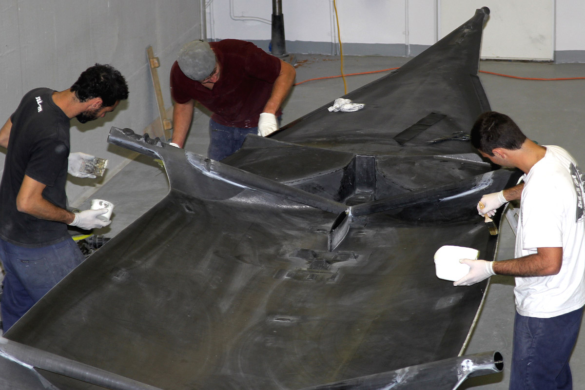 (l-r) Dan Grilk, Dylan Neilson & Nick Hord prepare the next new hull for the 2015-2016 Season