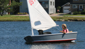 laser sailboat on top of car